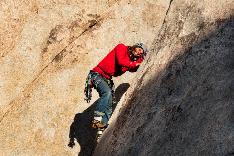 Climber placing gear at Echo T
