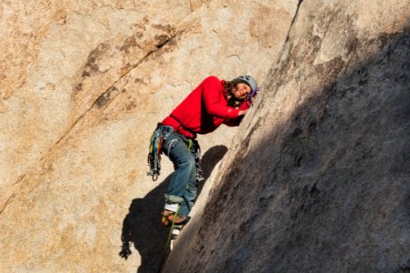 Climber placing gear at Echo T