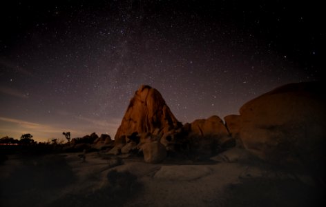 Night sky over boulders photo