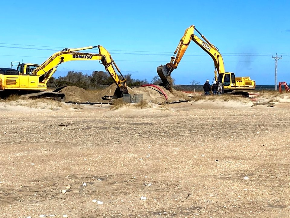 Heavy equipment digging trench