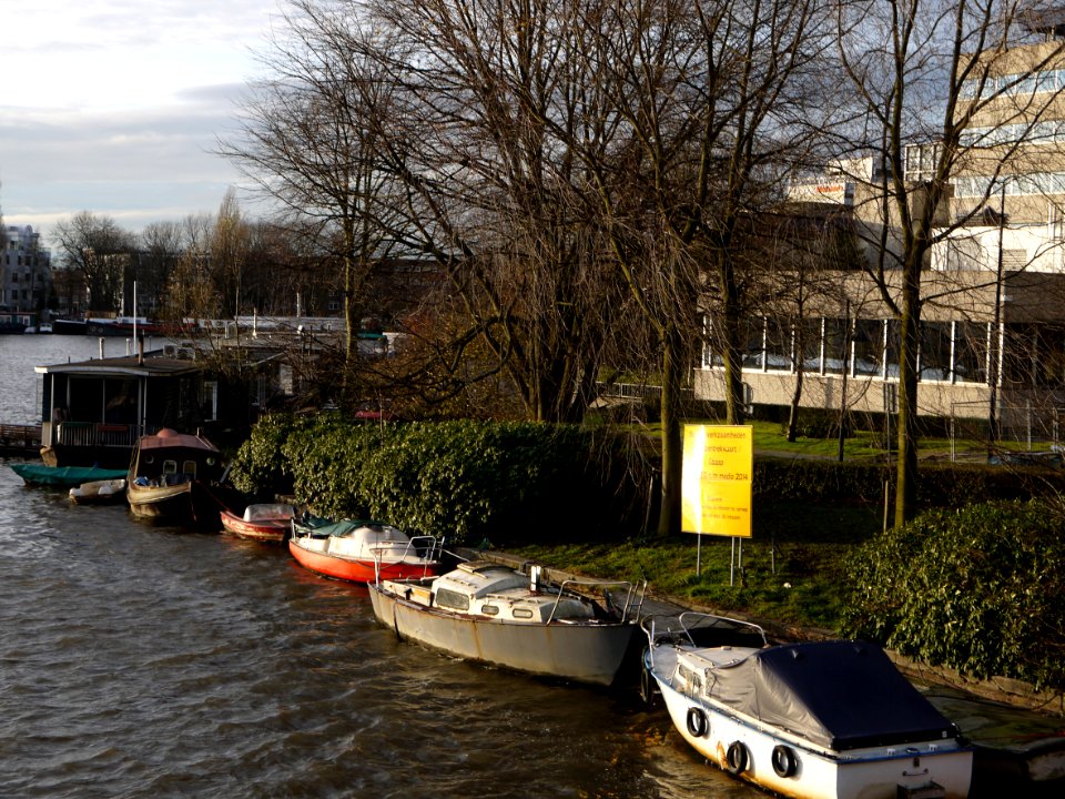 View on the Omval, side of Amstelkwartier along river Amstel; photo is taken from bridge over canal Weespertrekvaart / Spaklerweg - in the sun of December afternoon, Amsterdam city; - urban photography by Fons Heijnsbroek, the Netherlands, 2013