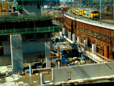 2005.04 - 'Deep view in the interior building pit' - Amsterdam photos and pictures; a construction works and pile sheeting along the train track of Amsterdam Centraal Stationr; Dutch city + geotag, Fons Heijnsbroek, The Netherlands photo