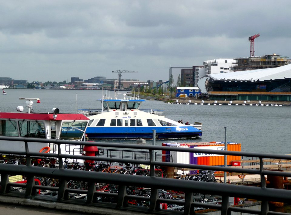 2011.06 - 'A view over the waterfront IJ', with a ferry of the city Amsterdam, seen from the area Central Station on the level of the new bus-station at the backside ; geotag free urban picture, in public domain / Commons CCO;  city photography by Fons He