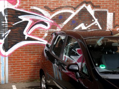 2016.04 - Amsterdam photo of graffiti art - 'Wall-tag meets car' - street art with reflections in Amsterdam city - geotagged free urban picture, in public domain / Commons; Dutch photography, Fons Heijnsbroek, The Netherlands photo