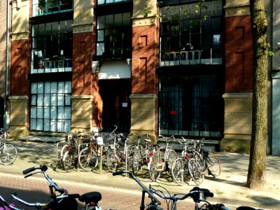 Photo of the facade of a modernistic & classic architecture office building in brick and metal construction, in the street Rapenburgerstraat close to the Flea-market in Amsterdam city; - urban photography by Fons Heijnsbroek, the Netherlands, 2013