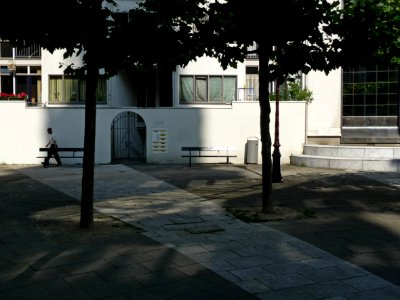 Close-up photo of Zuiderkerkplein (square of Southern Church, with trees, sunlight & shadows on brick pavement; location near Jo de Breestraat and the Flea-market, city center of Amsterdam; - urban photography by Fons Heijnsbroek, the Netherlands, 2013 photo