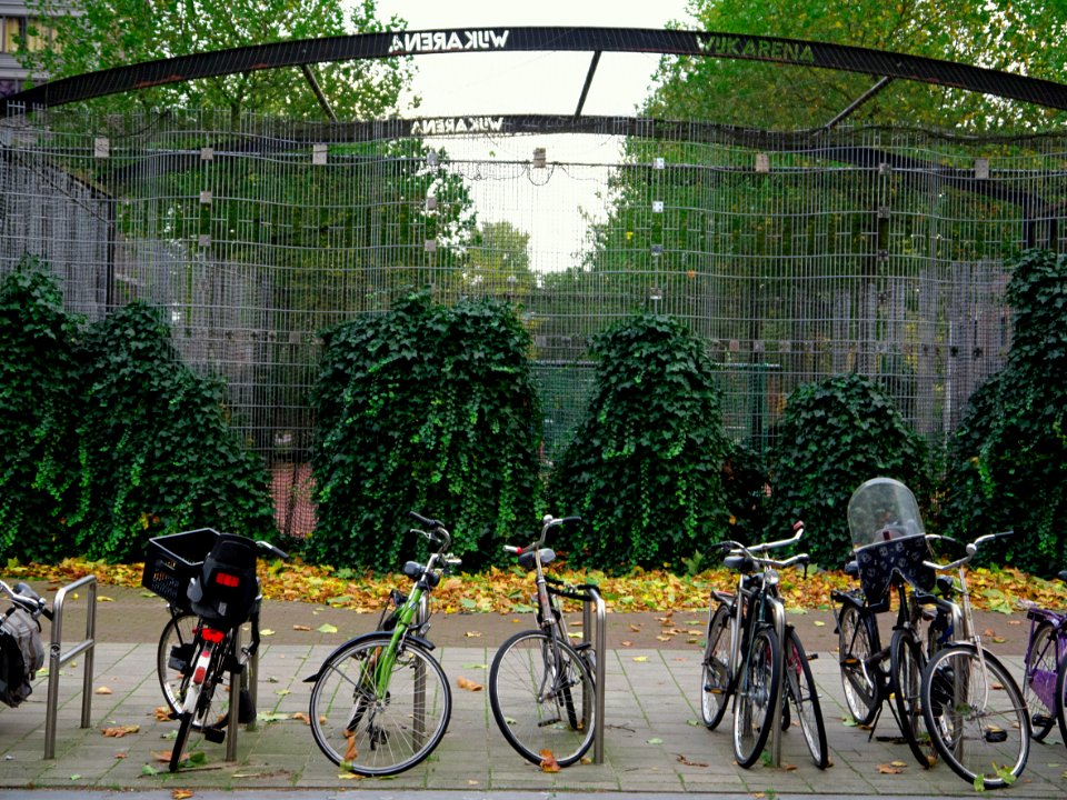 Parked bicycles in front of the football cage between Entrepotdok and LaagteKadijk in the city Amsterdam; urban photography in the Netherlands, Fons Heijnsbroek 2013