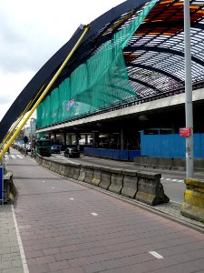 2011.06 - 'New arch-construction above the existing road with new concrete bus-platform -building of new roofed bus-station behind Central Station Amsterdam - east-side of the station; urban photography, Fons Heijnsbroek, 2011 photo