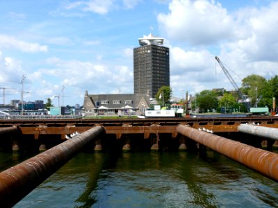 2007.08 - 'View over the North river-border' of the wide water IJ behind Central Station Amsterdam with the Shell-building and subway construction pit for the metro-tunnel; Dutch city photo + geotag, Fons Heijnsbroek, The Netherlands