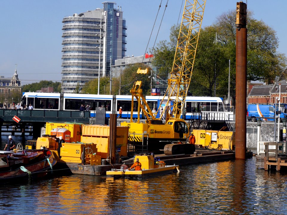 Free photo Amsterdam: picture of construction works in the canal-water, in front of Central Station Amsterdam - free pics