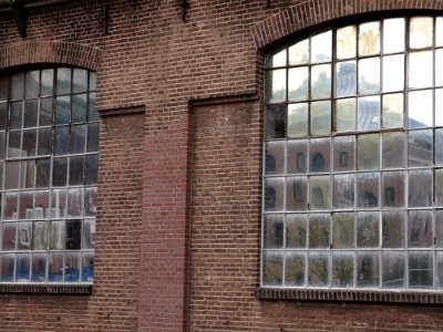 2016.04 - Amsterdam photo of reflecting windows and brick factory wall of the Jan van Gendt-hallen on Oostenburg - geotagged free urban picture, in public domain / Commons; Dutch photography, Fons Heijnsbroek, The Netherlands photo