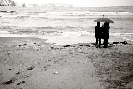 Girls share an umbrella winter