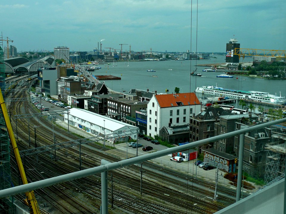 2007.08 - 'City and water-scape' - Amsterdam photos and pictures, a view over the train tracks along the city-side borders of the river water IJ, Amsterdam; Dutch city + geotag, Fons Heijnsbroek, The Netherlands
