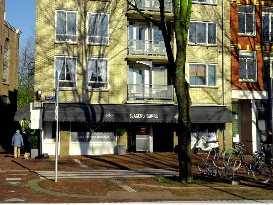 tree shadows on the brick facade, free photo Amsterdam, Fons Heijnsbroek photo