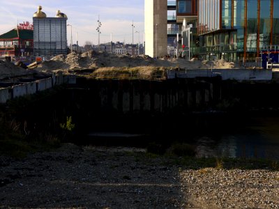 View on the Oosterdok waterfront in Amsterdam city with the last excavation site on the location of the demolished Post building, opposite the Science Center Nemo; location Oosterdokseiland - urban photography by Fons Heijnsbroek, the Netherlands, 2013 photo