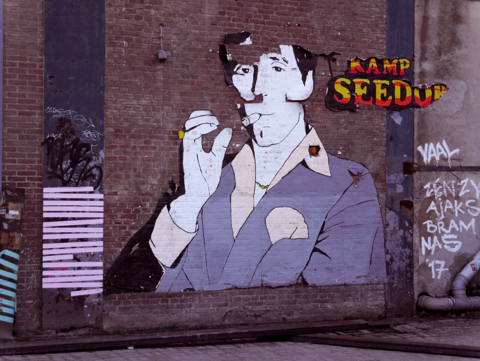 Graffiti in stencil art, glued om the brick wall of anc old factory - free photos Amsterdam, Fons Heijnsbroek