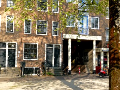 2013.04 - 'Old & modern house facades', with shadows of blossoming elm trees in Spring at the square Kattenburgerplein, on the border of the old city center of Amsterdam; urban photography, Fons Heijnsbroek photo