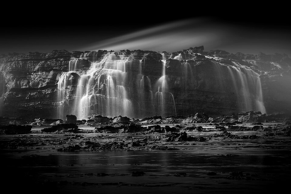 Long exposure gray waterfall gray rock
