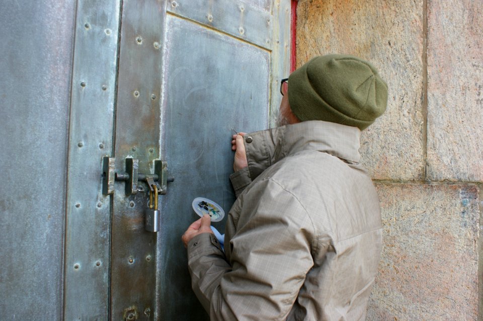 Conservator treating the Cape Hatteras Lighthouse Door