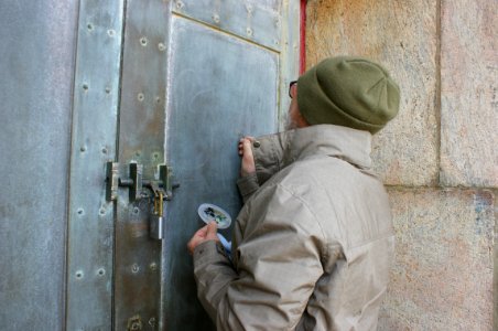 Conservator treating the Cape Hatteras Lighthouse Door