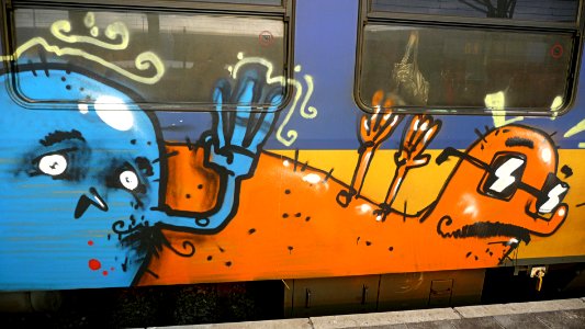2010.02 - 'Photo of a decorated Dutch train', sprayed / painted in graffiti art at the Central Station in Amsterdam - getoagged free urban photo, in public Commons domain; Fons Heijnsbroek, The Netherlands photo