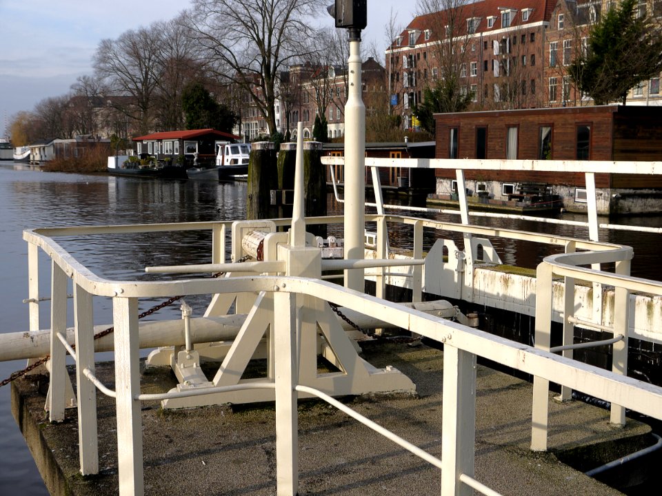 2014.01 - Amsterdam photo, Canal-view in Amsterdam city, with water-lock in the canal Nieuwe Vaart in front of the Oosterkerk; a geotagged free urban picture, in public domain / Commons CCO;  city photography by Fons Heijnsbroek, The Netherlands