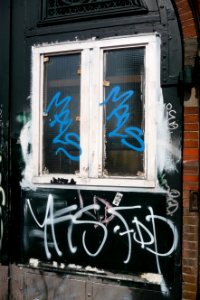2011.04 - 'Decorated front-door covered with graffiti tags', of a 19th century residence; Amsterdam city in Spring; geotag free urban picture, in public domain / Commons CCO; city photography by Fons Heijnsbroek, The Netherlands photo