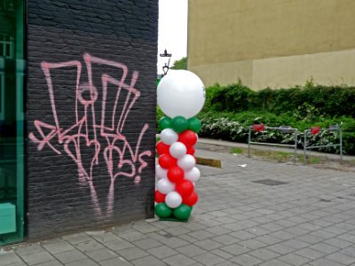 Urban stil-life of balloons & graffiti street art, on the Sarphatistraat - corner entrance to Roeterseiland in Amsterdam city; urban photography of The Netherlands, Fons Heijnsbroek, 2013 photo
