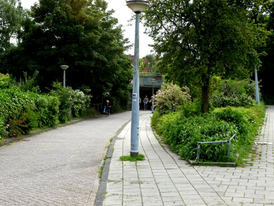 view of a small viaduct for pedestrians and cyclists under the train track through Amsterdam East - connecting Linnaeuskade on both sides; Amsterdam city; photo urban photography Fons Heijnsbroek, 2013
