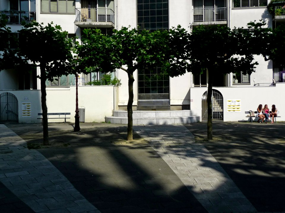 Close-up photo of Zuiderkerkplein (square of Southern Church, with trees, sunlight & shadows on brick pavement; location near Jo de Breestraat and the Flea-market, city center of Amsterdam; - urban photography by Fons Heijnsbroek, the Netherlands, 2013