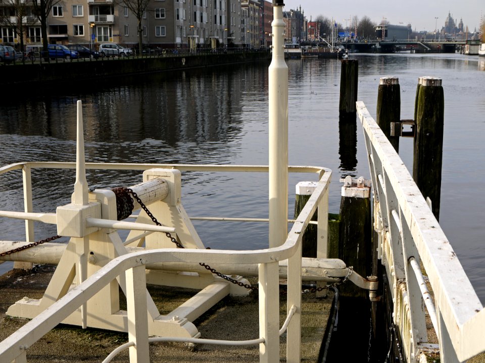 2014.01 - Amsterdam in photo: View on old water-lock doors in the canal-water of the Nieuwe Vaart, opposite Oosterkerk church; a geotagged free urban picture, in public domain / Commons CCO;  city photography by Fons Heijnsbroek, The Netherlands