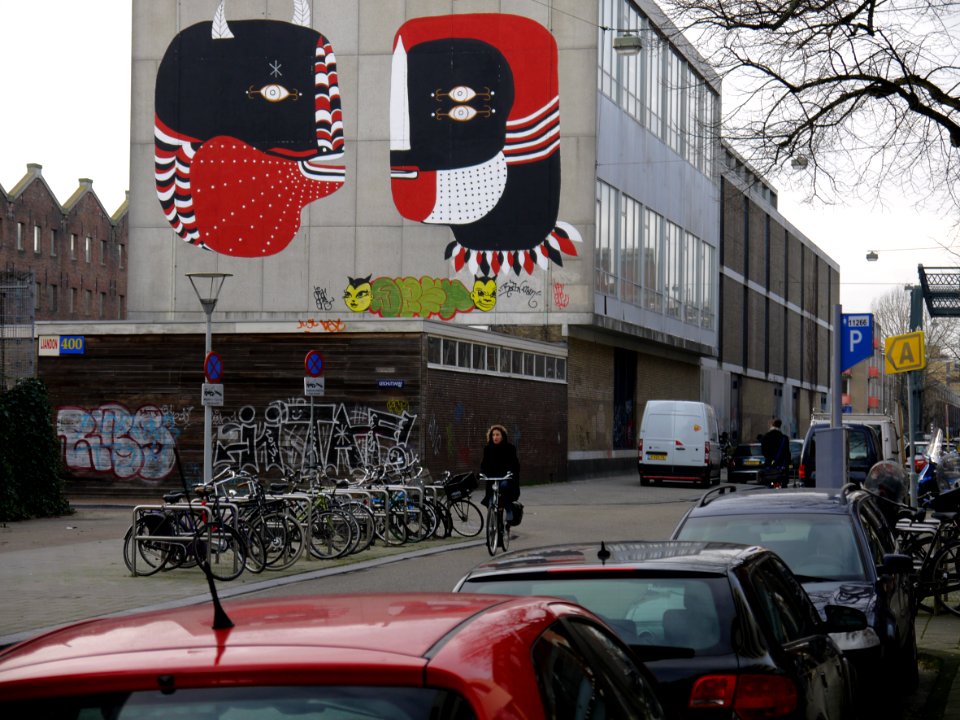2014.01 - Amsterdam photo, A large public wall art painting at Hoogte Kadijk street, with a nasty illegal graffiti creature down there; a geotagged free urban picture, in public domain / Commons CCO;  city photography by Fons Heijnsbroek, The Netherlands