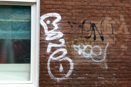 2011.05 - 'Urban collage of a group of graffiti tags', next to a window on a red-brick wall, in the district Kinkerkbuurt, Oud-West; geotag free urban picture, in public domain / Commons CCO;  city photography by Fons Heijnsbroek, The Netherlands