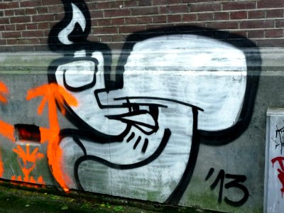 Urban street-art graffiti; throw-up face - painting on a brick house-wall in the Plantage Muidergracht very close to a construction site, in November 2013; photo Amsterdam city; urban photographer Fons Heijnsbroek, 2013 photo