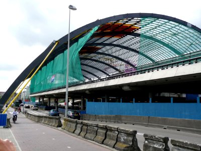 2011.06 - 'View on the arch-construction', during the building of the new roofed bus-station behind Central Station Amsterdam including colored glass letters in the roof - east-side of the station; urban photography, Fons Heijnsbroek photo