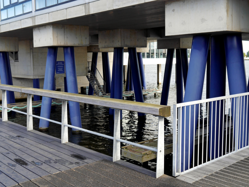 2016.10 - Amsterdam, photo of modern architecture - A building with its pillars in the IJ-water - geo-tagged free urban picture, in public domain / Commons; Dutch urban photography by Fons Heijnsbroek, The Netherlands photo