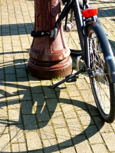 2013.04 - 'Photo of a parked urban bike and lamppost', with shadows in the sunlight of Spring on the street pavement on the street Da Costakade - district Kinkerbuurt, Amsterdam Oud-West; - urban photography by Fons Heijnsbroek, the Netherlands photo