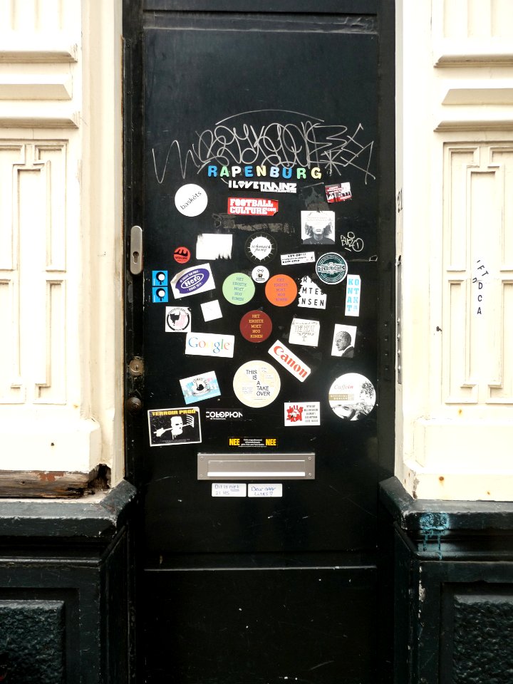 2015.04 - Amsterdam photo of signs - A door full of pastes - in the Plantage district; a geotagged free urban picture, in public domain / Commons CCO;  city photography by Fons Heijnsbroek, The Netherlands