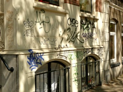2015.05 - Amsterdam, photo of street-art & shadows, sun-light & wall-tags on 19th century house-fronts in Sarphatistraat, Amsterdam city - geotagged free urban picture, in public domain / Commons; Dutch city photography, Fons Heijnsbroek, The Netherlands