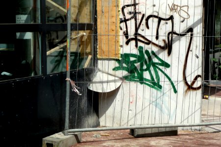 2011.05 - 'Photo of a construction site with an urban collage of building-fences', graffiti tags and sunlight of Spring; geotag free urban picture, in public domain / Commons CCO; city photography by Fons Heijnsbroek, The Netherlands photo