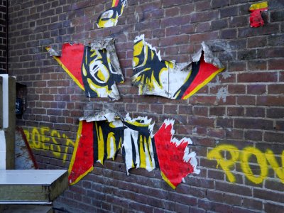 Graffiti in stencil art, glued on the brick wall - free photos of Amsterdam, Fons Heijnsbroek
