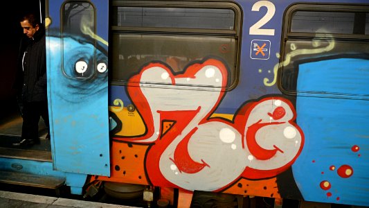 2010.02 - 'Photo of a decorated Dutch train - rail-car at the train-station decorated with graffiti art, location at the Central Station in Amsterdam - geo-tagged free urban photo, in public domain / Commons; Fons Heijnsbroek, The Netherlands photo
