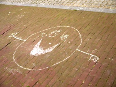 2015.04 - Amsterdam photo of street-art - A child's drawing Smiling Face, in white crayon on the pavement - Plantage district in Spring; a geotagged free urban picture, in public domain / Commons CCO; city photography by Fons Heijnsbroek, The Netherlands photo