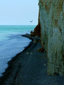 2007.09 - 'Seascape, a view over the cliff walls', and the pebbly shore near Petit-Dalle in Normandy France with a quiet sea; French landscape photography, Fons Heijnsbroek photo