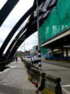 2011.06 - 'A close-up view on the metal arches', of the construction for the bowed glass roof of the new bus-station behind railway Central Station of Amsterdam city; urban photography, Fons Heijnsbroek photo