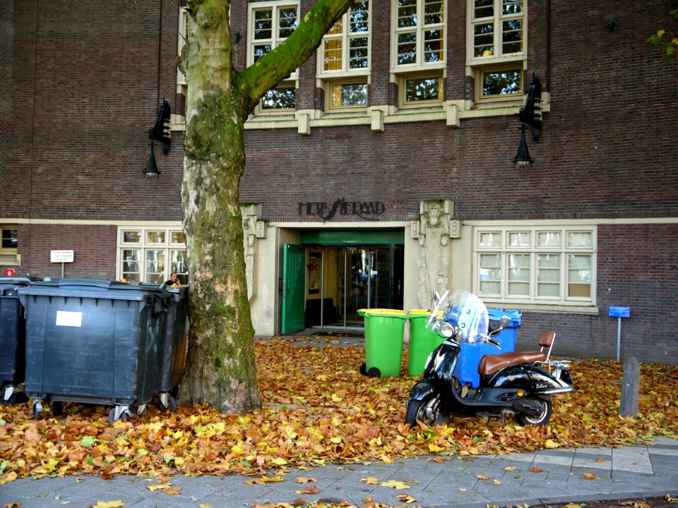 Autumn in the city Amsterdam with fallen leaves from plane trees; school-building facade near the canal Kostverlorenvaart, on the corner of Postjesweg and Baarsjesweg, in Amsterdam city; urban photography in the Netherlands, Fons Heijnsbroek 2013