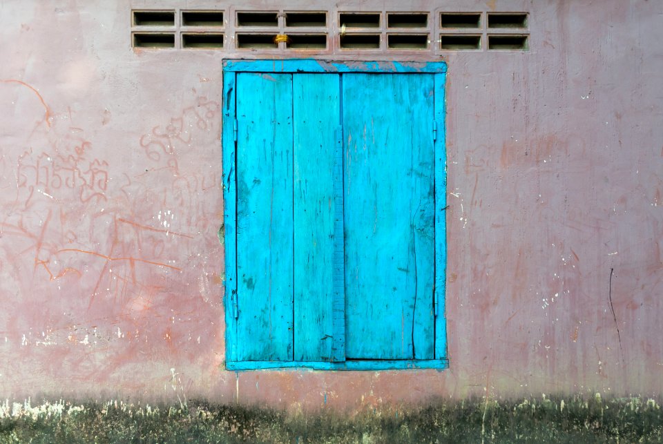Painted wall with blue door