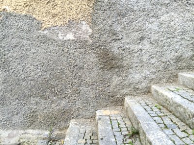 Old plastered wall with cracks photo
