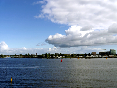 2016.10 - Amsterdam, photo of a blue sky with drifting clouds above the water-front of the IJ-river - geo-tagged free urban picture, in public domain / Commons CCO; Dutch urban photography by Fons Heijnsbroek, The Netherlands