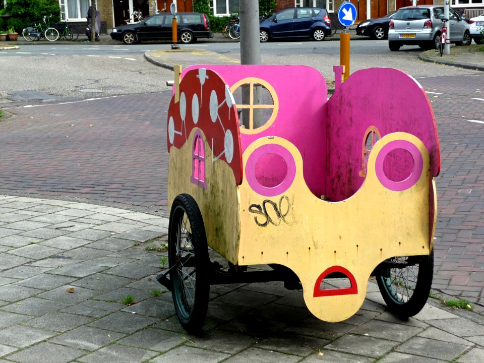 A picture of bicycle city - a bike for transporting a bunch of young kids or children through thew streets of the city; photo urban photography Fons Heijnsbroek, 2013